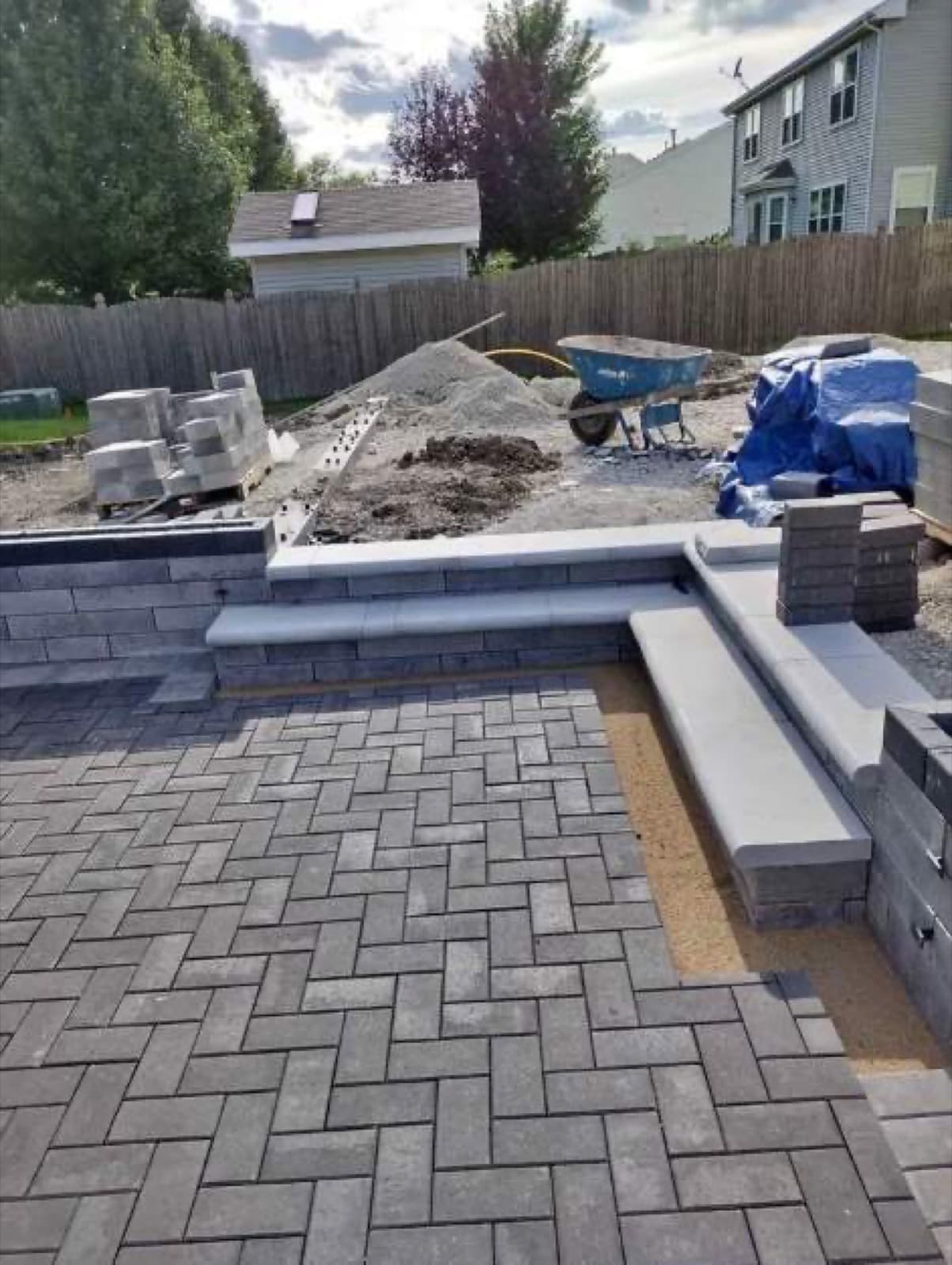 Gray herringbone paver patio at new construction home in Central Florida — Firsthand Lawn and Landscape