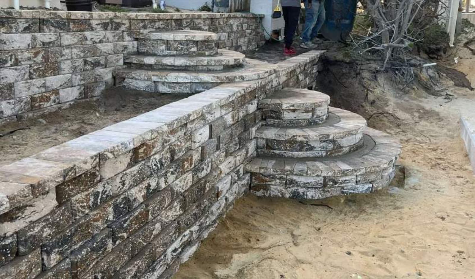Stacked stone wall in beachside Central Florida setting — Firsthand Lawn and Landscape